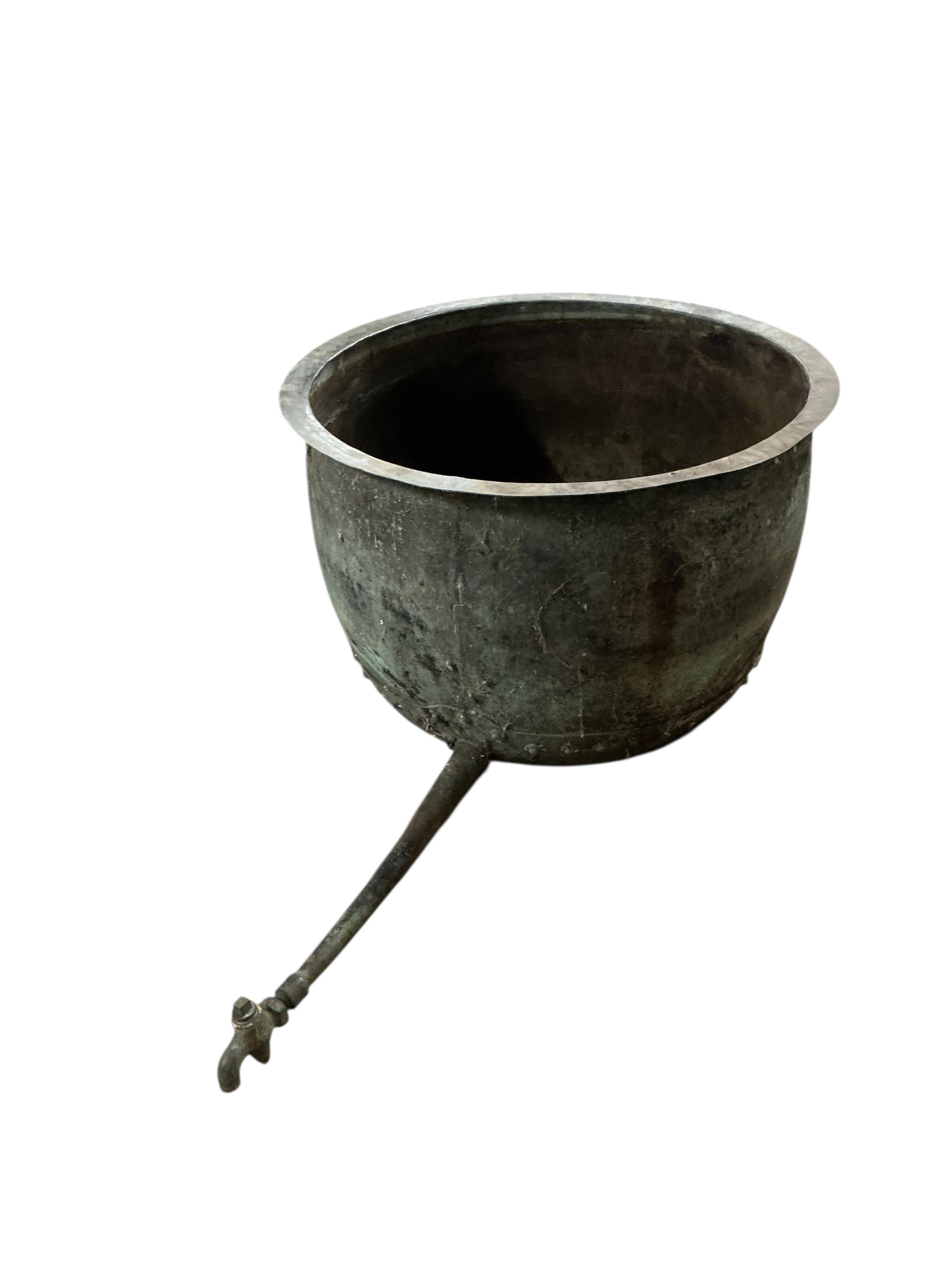 A large Victorian circular copper copper with long tapered spigot, diameter 84cm, height 54cm